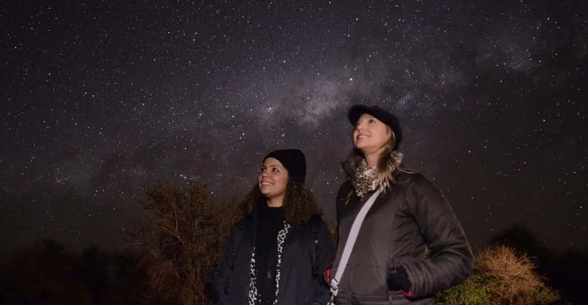 Guide pointing a laser at the southern night sky during an etno-astronomical Atacama Desert stargazing tour in Chile