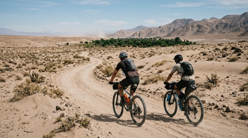 Cyclists on a dirt track through the open desert on a 4-hour Atacama Desert bicycle tour near San Pedro